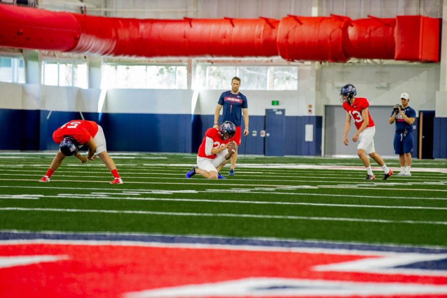 Arizona football kicker practices long distance kicking in the new Cole and Jeanne Davis Sports Center. 