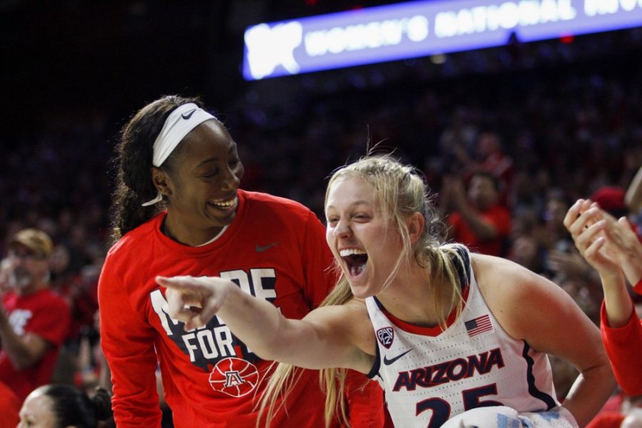 Cate Reese (25) celebrates with Desitny Graham after UA scored against TCU on Wednesday, April 3rd. UA defeated TCU 59-53 at the McKale Stadium and will go on to the champion game against Northwestern.