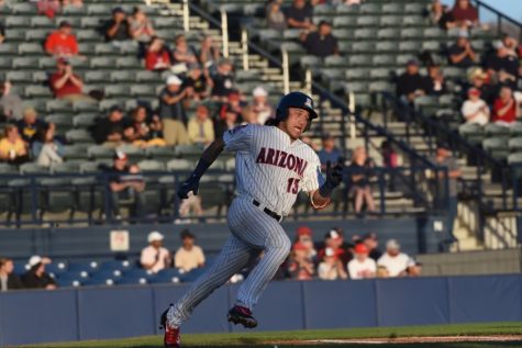 Arizona's junior infielder Nick Quintana running to first base in the game against the University of California Berkley Bears on April 13, 2019, at Hi Corbett Field. The game ended in a final score of 7-3, a win for the Bears.