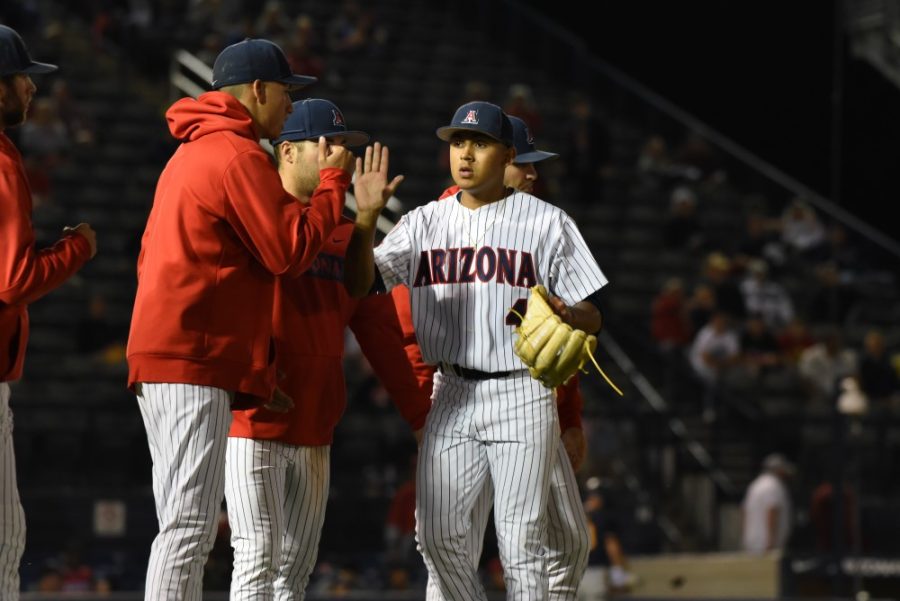 Arizonas+teammates+high-fiving+Arizonas+sophomore+pitcher+Gil+Luna+during+the+game+against+the+University+of+California+Berkley+Bears+on+April+13%2C+2019%2C+at+Hi+Corbett+Field.+The+game+ended+in+a+final+score+of+7-3%2C+a+win+for+the+Bears.+
