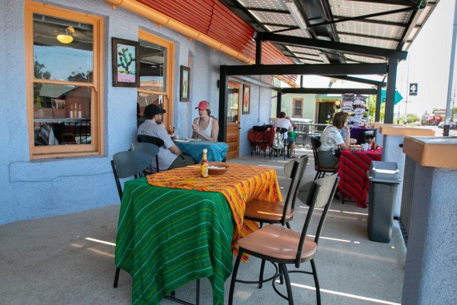 Cafe Tumerico’s new location on Fourth Avenue near the UA campus has a patio space with tables for customers to enjoy beverages and food. 