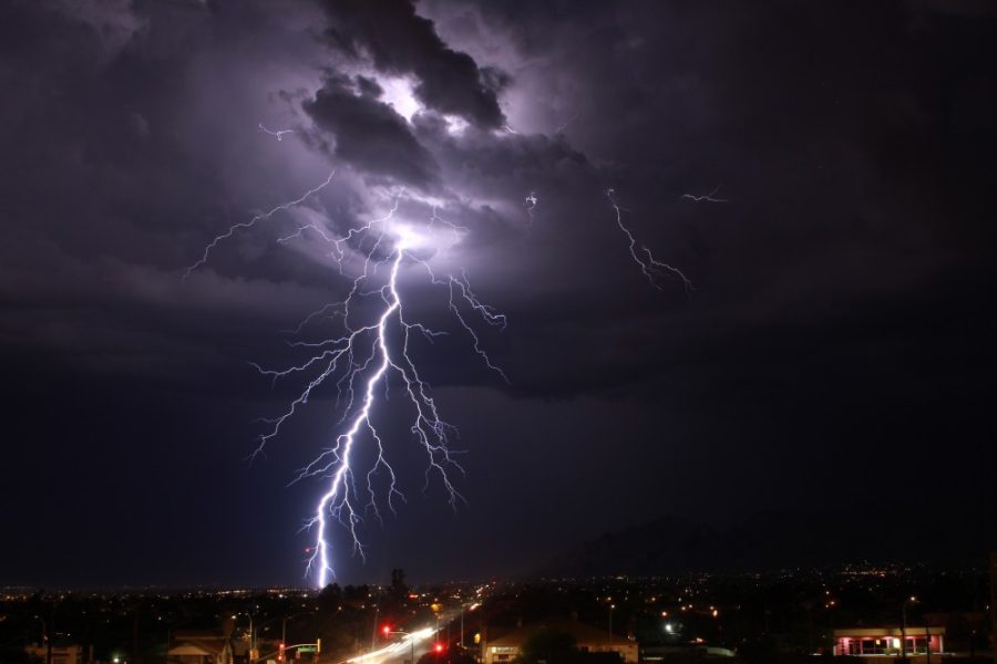Taken at the top of Main Gate Garage; lightning hitting Tucson, a sign of Monsoon season starting.