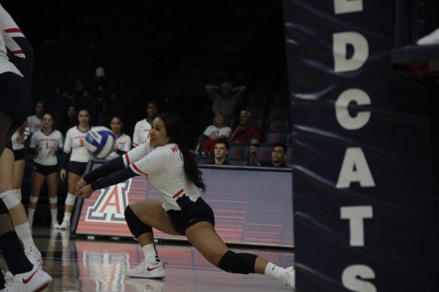 Senior Emi Pua’a (33) digs a spiked ball and enables the team to score off the next hit.