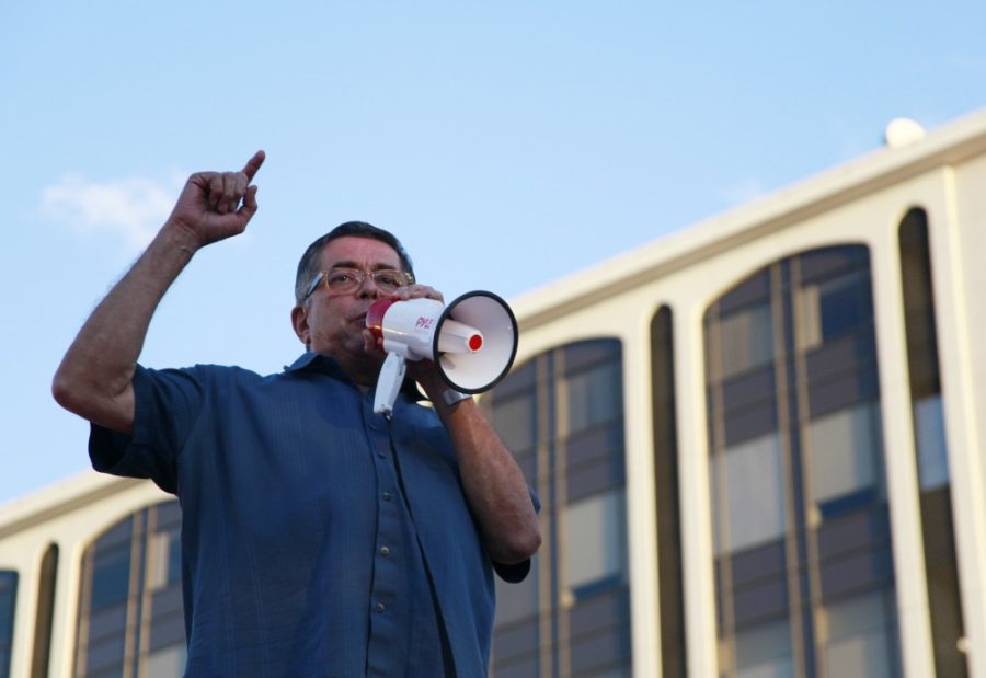 Richard Elias speaks to environmentalists to promote the combat of climate change in El Presidio Park in downtown Tucson, Az on Friday, Sept. 20, 2019. 