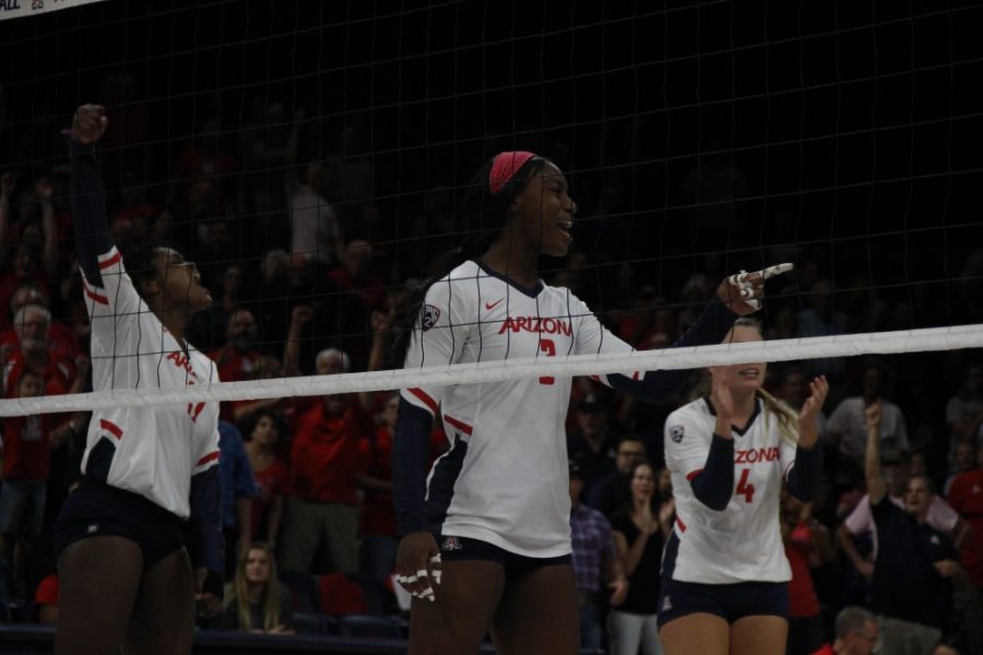 The team celebrates after scoring the last point to secure the sweep against New Mexico State University.