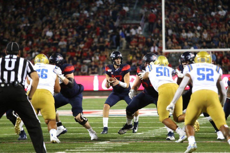 Wildcat Grant Gunnell (17) looks for a teammate to pass the ball to, during the second quarter of the Arizona-UCLA game on Friday September 28, 2019. 