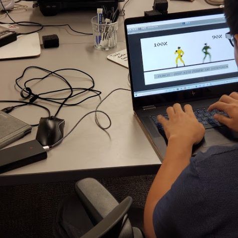 A game developer touches up the details of his new online game during the UA Game Jam on Oct.5.