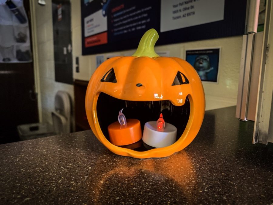 Coconino Residence Hall’s reception desk decorated for Halloween, 2019. 