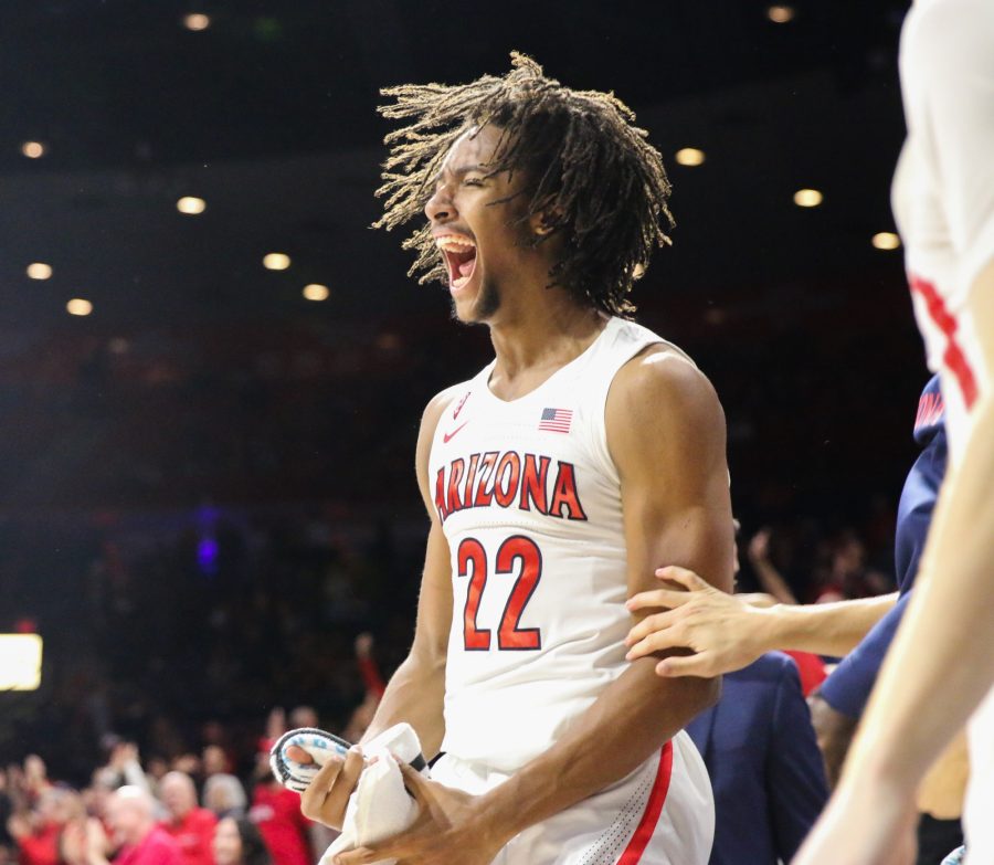 After watching Matt Weyand score the last point of the game, Zeke Nnaji (22) gets the crowd hype by yelling alongside the rest of the Wildcats. 
