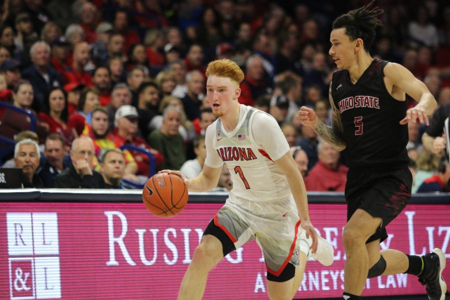 Wildcat Nico Mannion (1) runs down the court during the Arizona-Chico State game at the McKale Center on Friday November 1 in Tucson. At halftime the score Arizona was down 32-31.