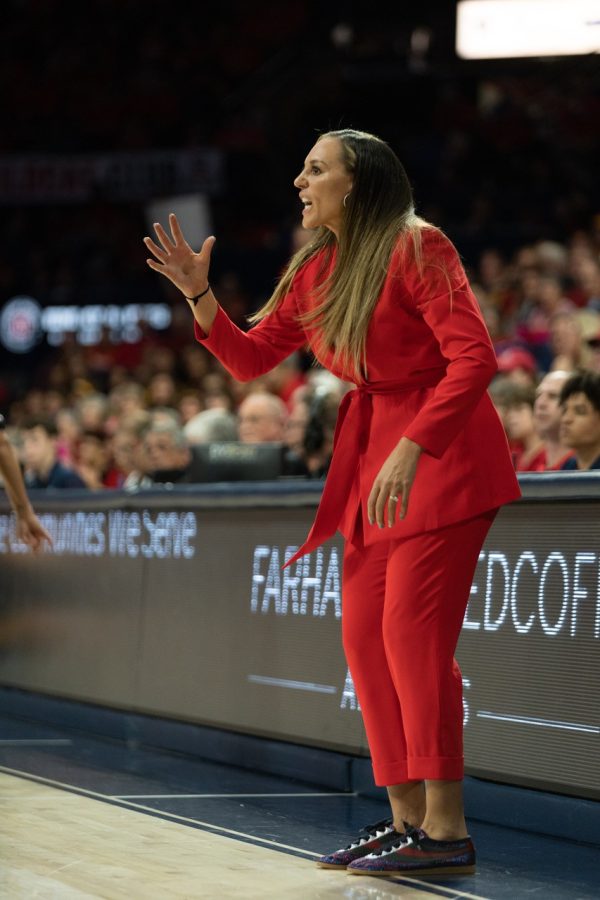 The Arizona womens basketball Head Coach Adia Barnes coaches her team from the sidelines 