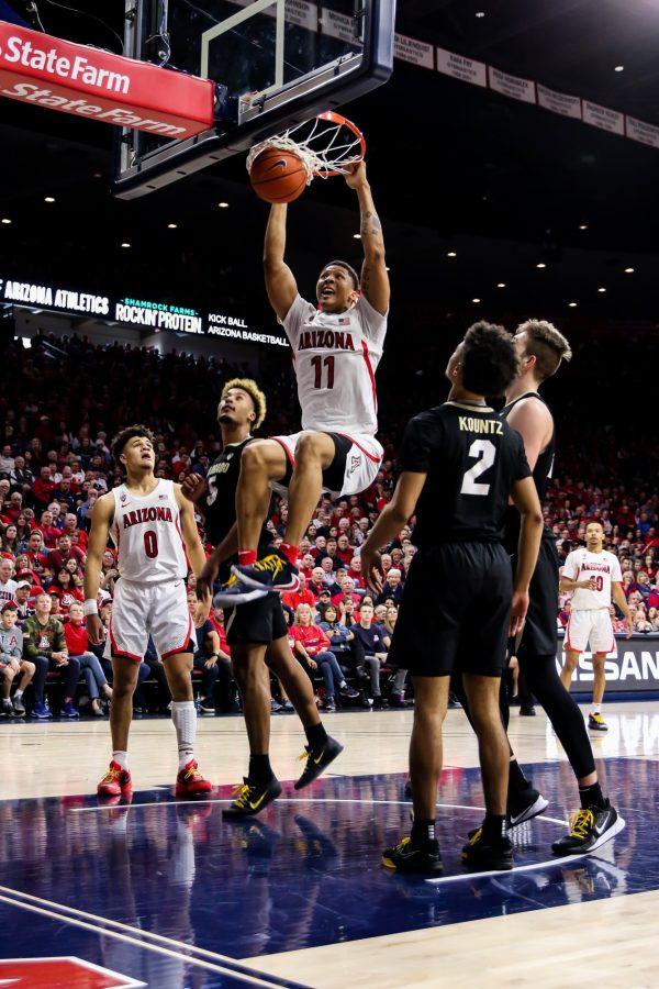 Throughout the game, Ira Lee (11) continued to dunk against Colorado and kept the Wildcats spirits up. 