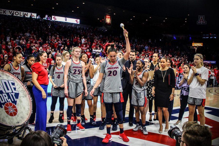 Wildcats+celebrating+win+against+USC+with+the+score+of+57-73.+Dominique+McBryde+getting+ready+to+bang+that+drum+as+she+is+selected+as+player+of+the+game.