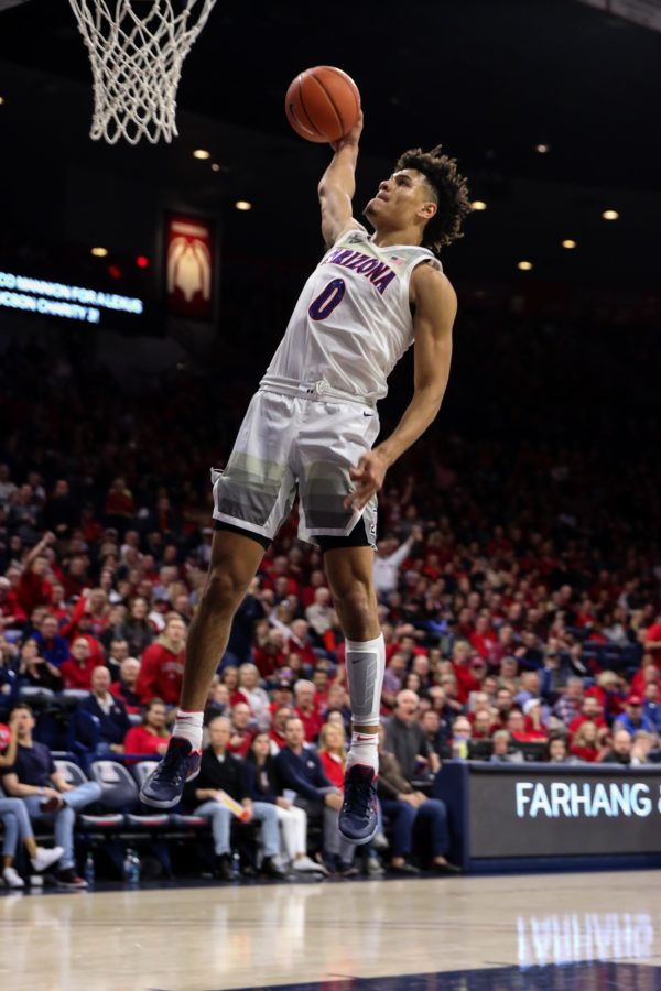 During the second half, Arizona freshman Josh Green (0) continues to  dunk against USC. The Wildcats defeated the Trojans 85-80. 