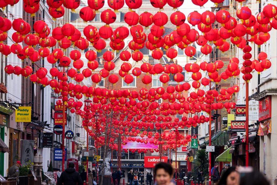 In celebration of the Chinese New Year, people hang lanterns throughout the streets. 