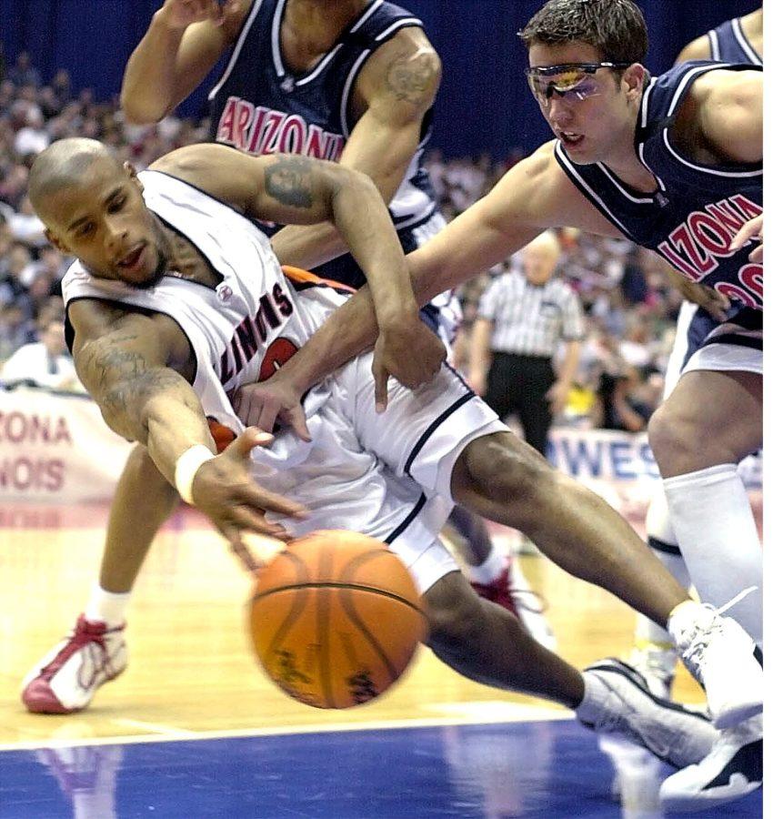 Illinois Sergio McClain dives for the ball after being pushed by Arizonas Justin Wessel (30) in the NCAA Midwest Region Final in San Antonio, Texas, Sunday, March 25, 2001. Arizona beat Illinois 87-81 and advance to the Final Four.