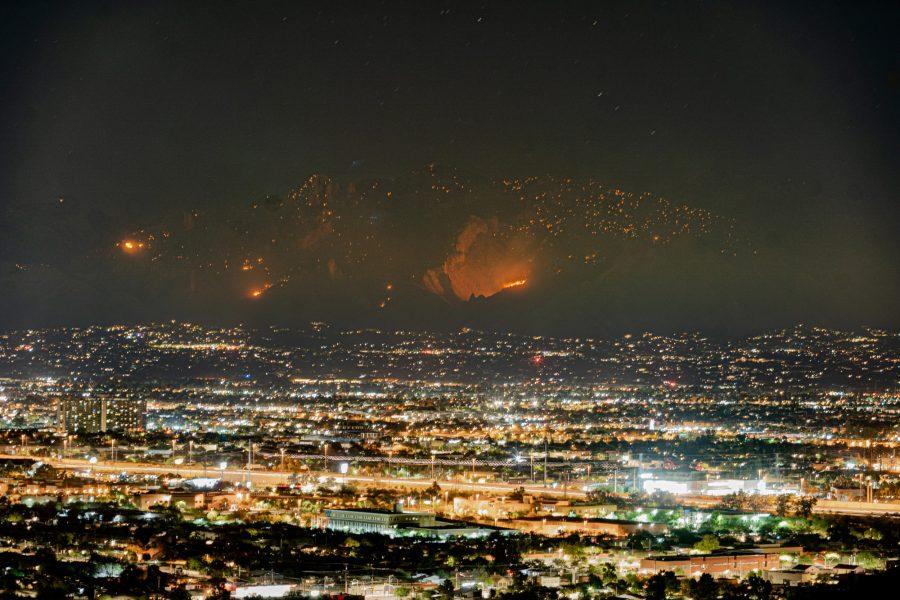 Bighorn Fire photographed from the top of A Mountain (Sentinel Peak) as fires continue to burn. The City of Tucson is seen in the foreground as fire burns and continues to get closer.