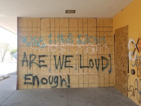 "Are we loud enough?" spray painted on wall in Minneapolis, Minnesota. 