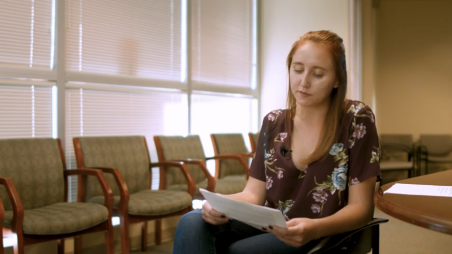 Joann Kohng reading over the process of Title IX that governs over UA. Screenshot from Joann Kohngs film Subject to Title IX.