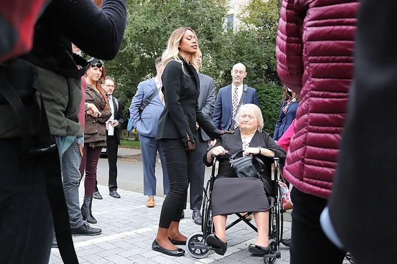  Aimee Stephens (in the wheelchair) among others (Laverne Cox), outside of the Supreme Court building on the day of her case before the Court. (Wikimedia Commons) 