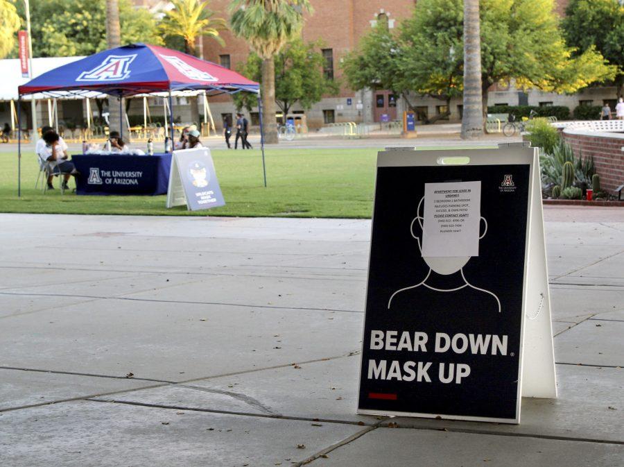 Signs+scattered+throughout+the+University+of+Arizona+campus+remind+students+to+mask+up+and+bear+down+amidst+the+COVID-19+pandemic+on+Monday%2C+Sept.+28%2C+2020.