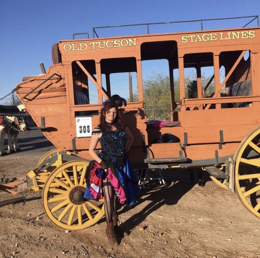 Charity Stevens stands in front of Old Tucson Studio’s entry in the Tucson Rodeo Parade on Thursday, Feb. 20, 2020 in Tucson, Ariz. Stevens was honored as Old Tucson Studio’s employee of the year; the last one since its closure. 