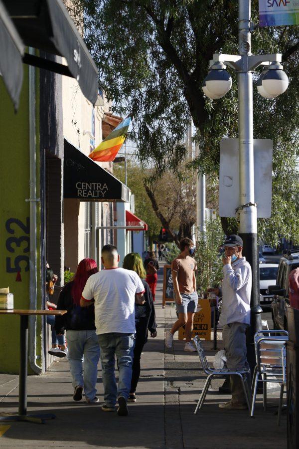 Fourth Avenue patrons walking toward the Thornhill Lopez Center, a SAAF place for LGBTQ+, while wearing masks in public on Historic Fourth Avenue in Tucson on Friday, Oct. 2, 2020.