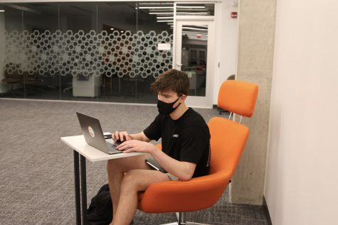 Trenton Dianovich, freshman, works on assignments for his ENGL101 class. Masks must be worn at all times in the library.