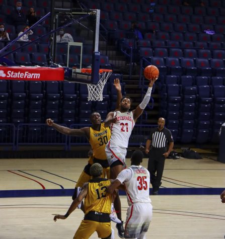 Jordon Brown a Sophomore on the University of Arizona’s Men’s basketball team takes a hook
shot as he dribles through two Gambling State players in the McKale Memorial Center, Friday,
Nov 27, 2020. The Wild Cats went on to win the game 74-55.