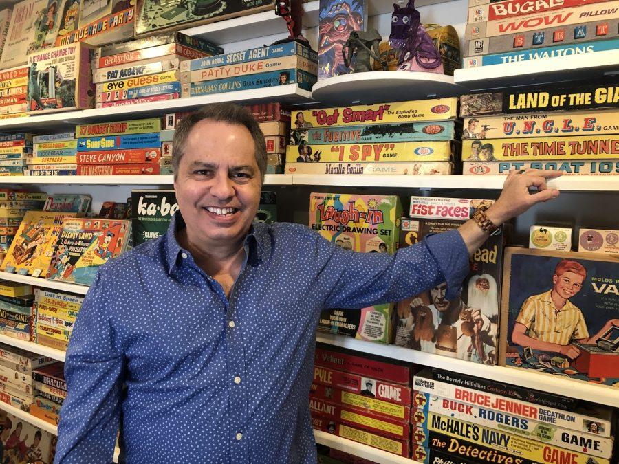 Rick+Polizzi+stands+in+front+of+his+impressive+collection+of+vintage+games.+Polizzi+won+three+Primetime+Emmy+awards+for+his+work+as+a+producer+for+The+Simpsons.+%28Courtesy+Rick+Polizzi%29%26nbsp%3B