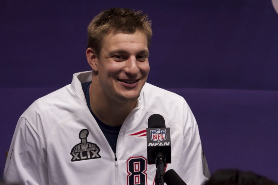 Tampa Bay Buccaneers tight end Rob Gronkowski sits at the podium and answers questions ahead of Super Bowl 49 in Phoenix, Ariz. in February of 2014. Rob Gronkowski talks Super Bowl XLIX in Phoenix by WEBN-TV is licensed under CC BY-ND 2.0