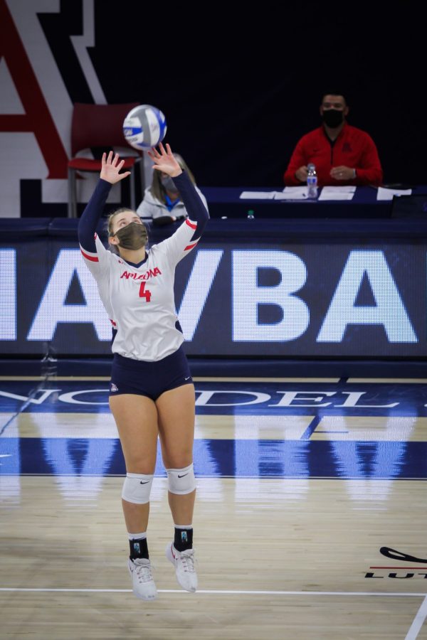 Arizona volleyball player Emery Herman jumps up for a set pass on Feb. 19, 2021, in McKale Center.