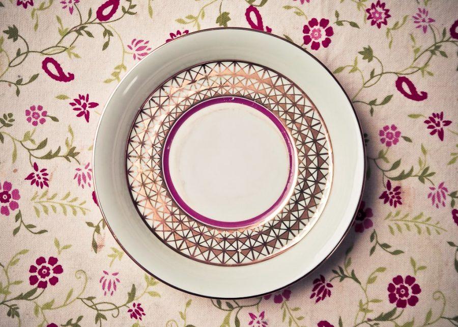 A photo of an empty plate on a tablecloth. Photo by sightone/CreativeCommons (CC BY-NC-SA 2.0)