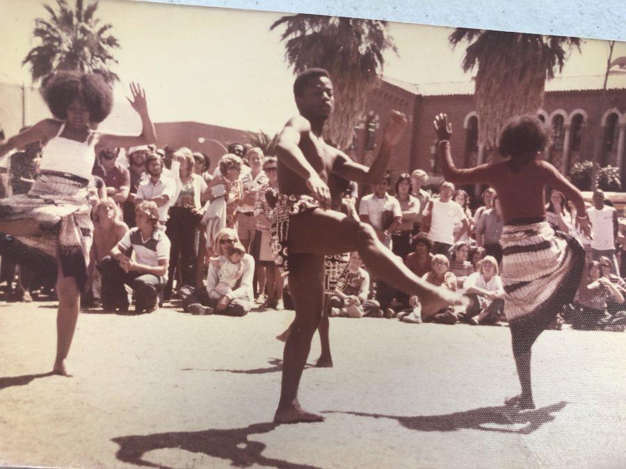 A captivated audience watches Barbea Williams (left) and Willie Ray Bell (right) perform Akwaaba to West Africa on the UA Mall ca. 1977. (Courtesy Barbea Williams)