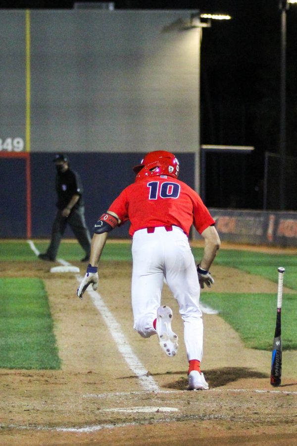 Jacob Blas runs to first base. The Wildcats defeated the Sun Devils 14-2 on Tuesday, April 6 at Hi Corbett Field.