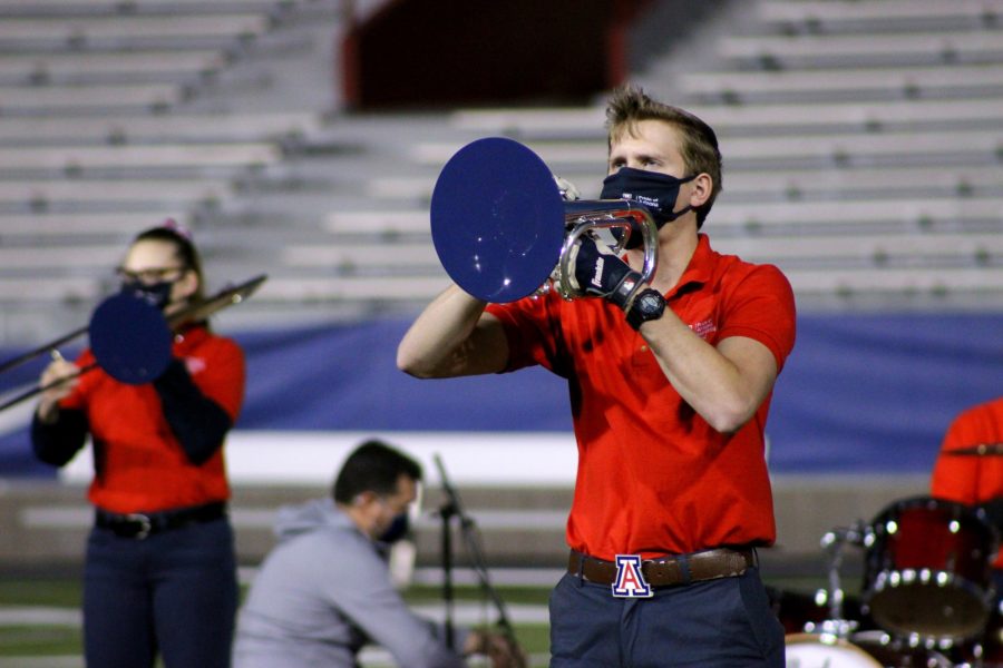 Max+Tucker%2C+a+drum+major+for+the+Pride+of+Arizona+marching+band%2C+plays+the+mellophone+during+pep+band+rehearsal+on+the+Arizona+Stadium+football+field+on+Wednesday%2C+March+3%2C+2021%2C+in+Tucson%2C+Ariz.+They+were+there+to+record+a+few+songs+while+dressed+in+uniform.