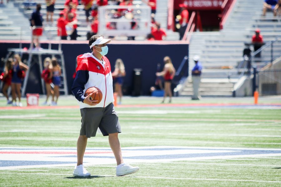 Jedd Fisch, head coach of Arizona football, prepares for the basketball tip in Tucson, Ariz. on Saturday, April 24. The tip took the place of the traditional coin toss.
