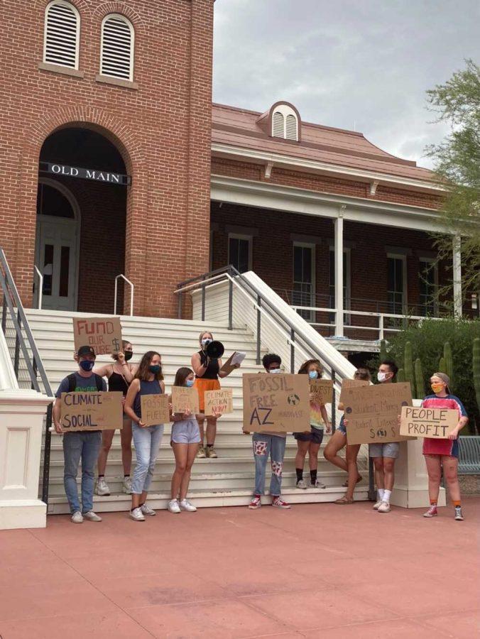 Members of UAZ Divest protest the University of Arizonas investments in fossil fuels outside of Old Main.
