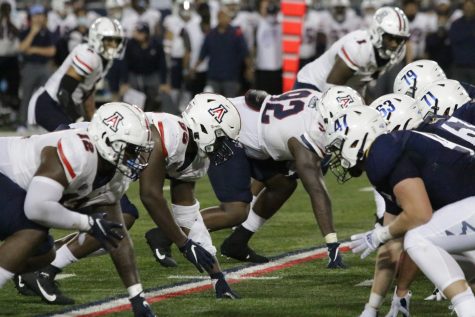 Arizona defensive linemen line up prior to the snap of the ball. Arizona's defense gave up 244 yards and forced three turnovers to NAU on Saturday.