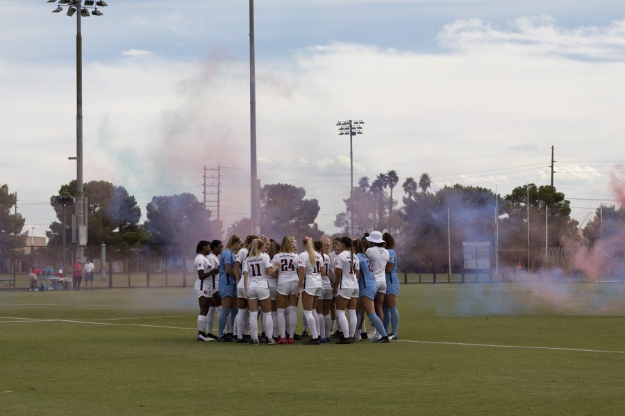 The Arizona soccer team huddles up on Murphey Field before the game against USC at Mulcahy Soccer Stadium on Oct. 3. The game ended with a final score of 1-4 and a win for USC.