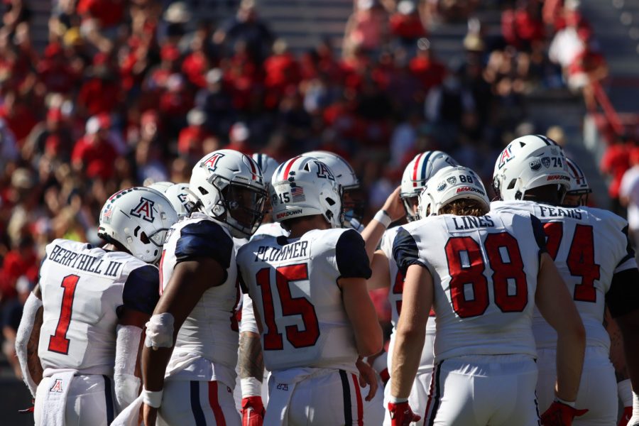 The Arizona offense huddles during a timeout at Arizona Stadium on Nov. 13. The Arizona offense scored 17 points in the first half.