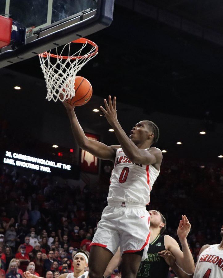 Bennedict Mathurin, a guard on the Arizona mens basketball team, takes a layup on Saturday, Nov. 27, in McKale Center. The Wildcats went on to win the game 105-59.