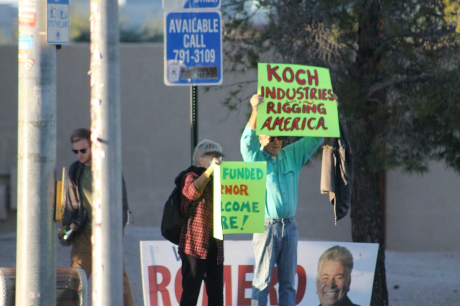 Two+individuals+protesting+the+alleged+of+Charles+Koch+on+UA%26%238217%3Bs+Freedom+Center+at+the+intersection+of+Speedway+Blvd+and+Campbell+Avenue+on+Thursday%2C+Oct.+28.+Individuals+at+the+protest+were+members+of+activist+groups+Extinction+Rebellion+and+Kochs+off+Campus.