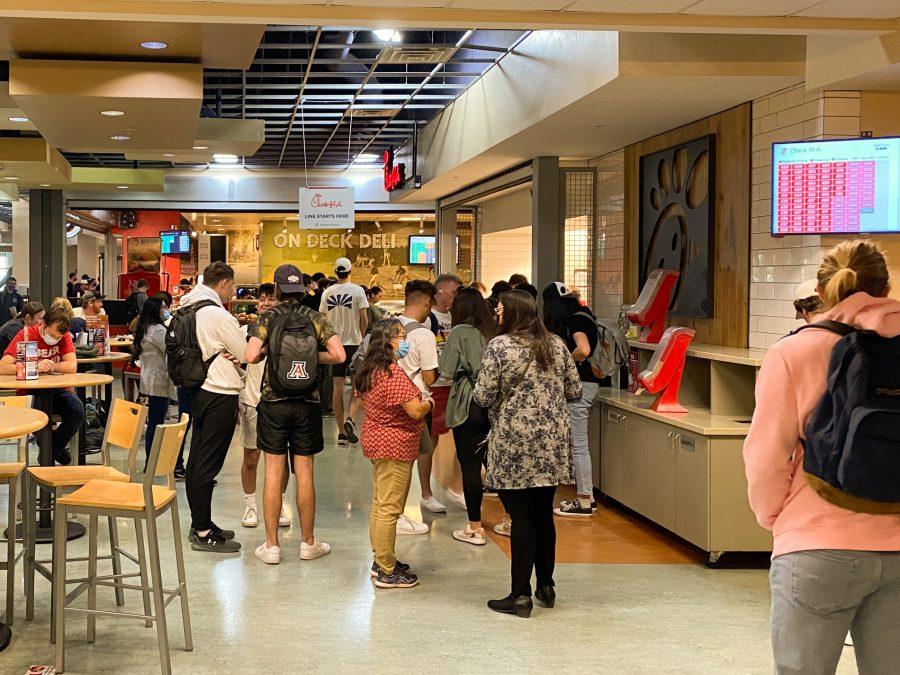 Students wait in line to take their order and then wait to get their food at the Chick-fil-a at the Student Union Memorial Center. The Chick-fil-a is a popular place for students to grab lunch. 