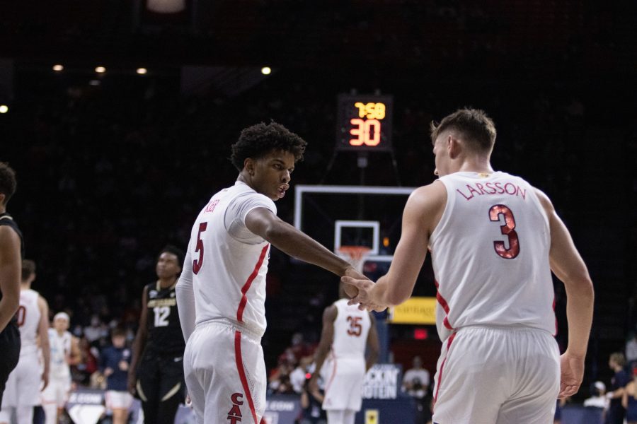 Univeristy of Arizona mens basketball players, Justin Kier (5) and Pelle Larsson (3) celebrate after a defensive stop at McKale Center in Tucson, Ariz on Jan. 13. Arizona held the University of Colorado to 55 points.