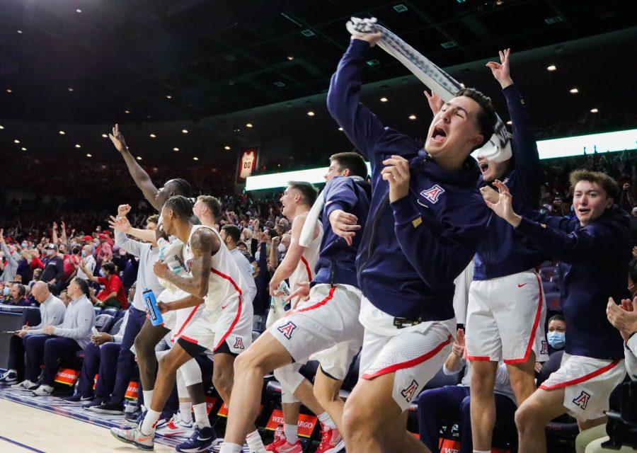 The Arizona mens basketball team bench celebrates after a massive three-point shot from Justin Kier on Saturday, Jan. 15 in McKale Center. The Wildcats went on to win the game 82-64.