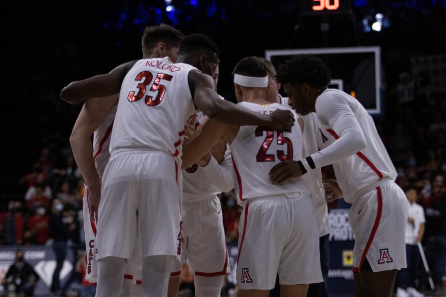The+University+of+Arizona+mens+basketball+team+huddles+during+a+timeout+at+McKale+Center+on+Feb.+3.+Arizona+leads+the+University+of+California%2C+Los+Angeles+42-30+at+the+half.