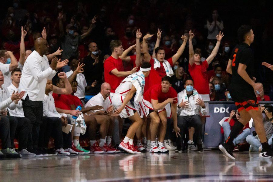 The Arizona mens basketball team celebrates a 3-point shot against Oregon State University on Feb. 17 in McKale Center. The Wildcats went on to win the game 83-69.