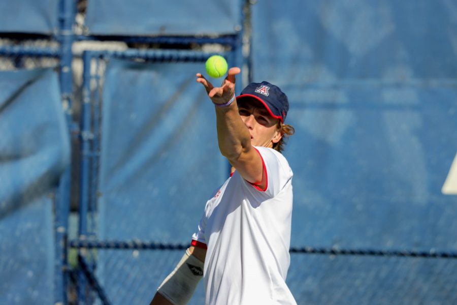 Herman Hoeyeraal, a player on the Arizona mens tennis team, starts his serve in a match against the University of San Diego on Feb. 4, at the Robson Tennis Center in Tucson, Arizona. Herman snuck a win out of his first match and got ready for singles play.