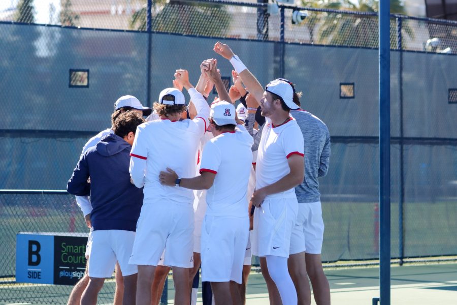 The Arizona mens tennis team gets ready before a match against the University of San Diego on Feb. 4 at the Robson Tennis Center. The UA mens tennis team, ranked No. 16 in the country, went on to lose the first two doubles matches by close scores.